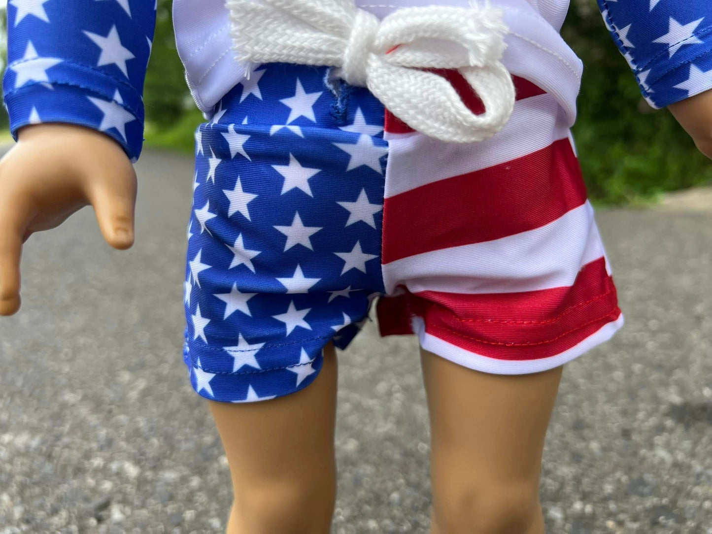 DOLL white swim top with blue sleeves and flag swim shorts set