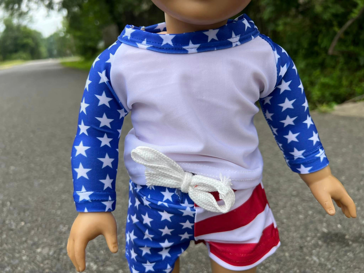DOLL white swim top with blue sleeves and flag swim shorts set