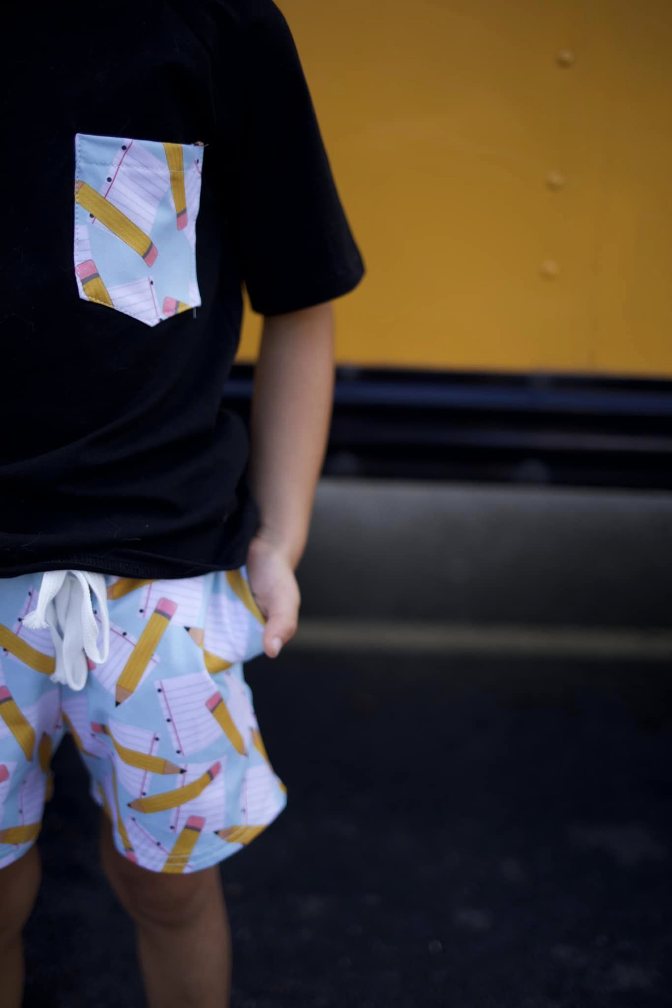 black pencil and paper pocket tee