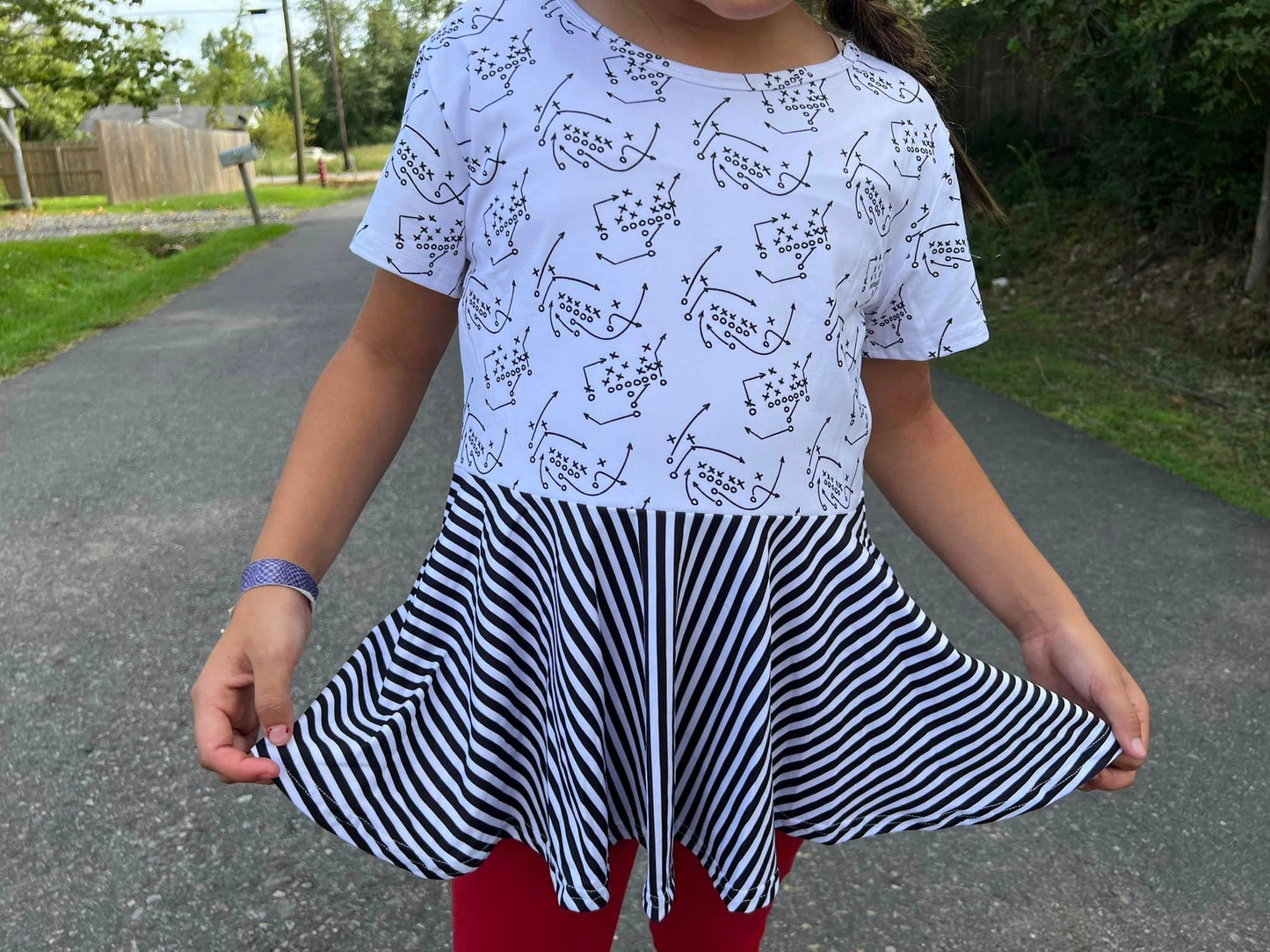 white and stripes football plays twirl top