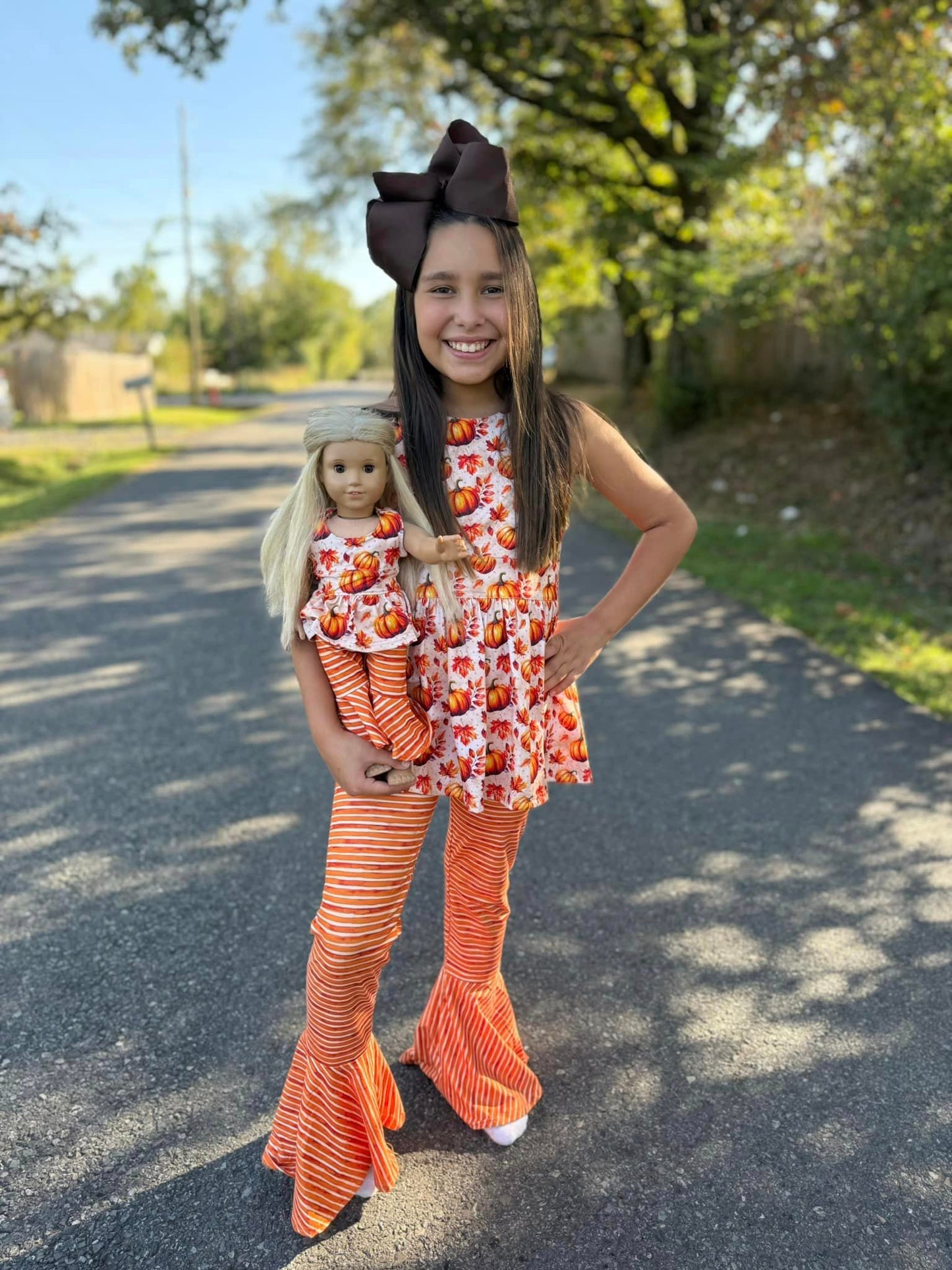 DOLL fall pumpkin cross back top and orange/cream stripe extra wide bells