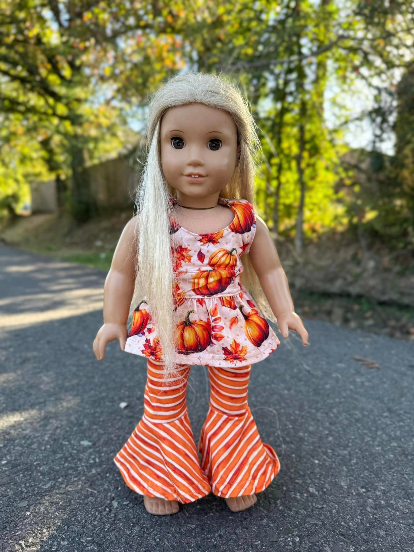 DOLL fall pumpkin cross back top and orange/cream stripe extra wide bells