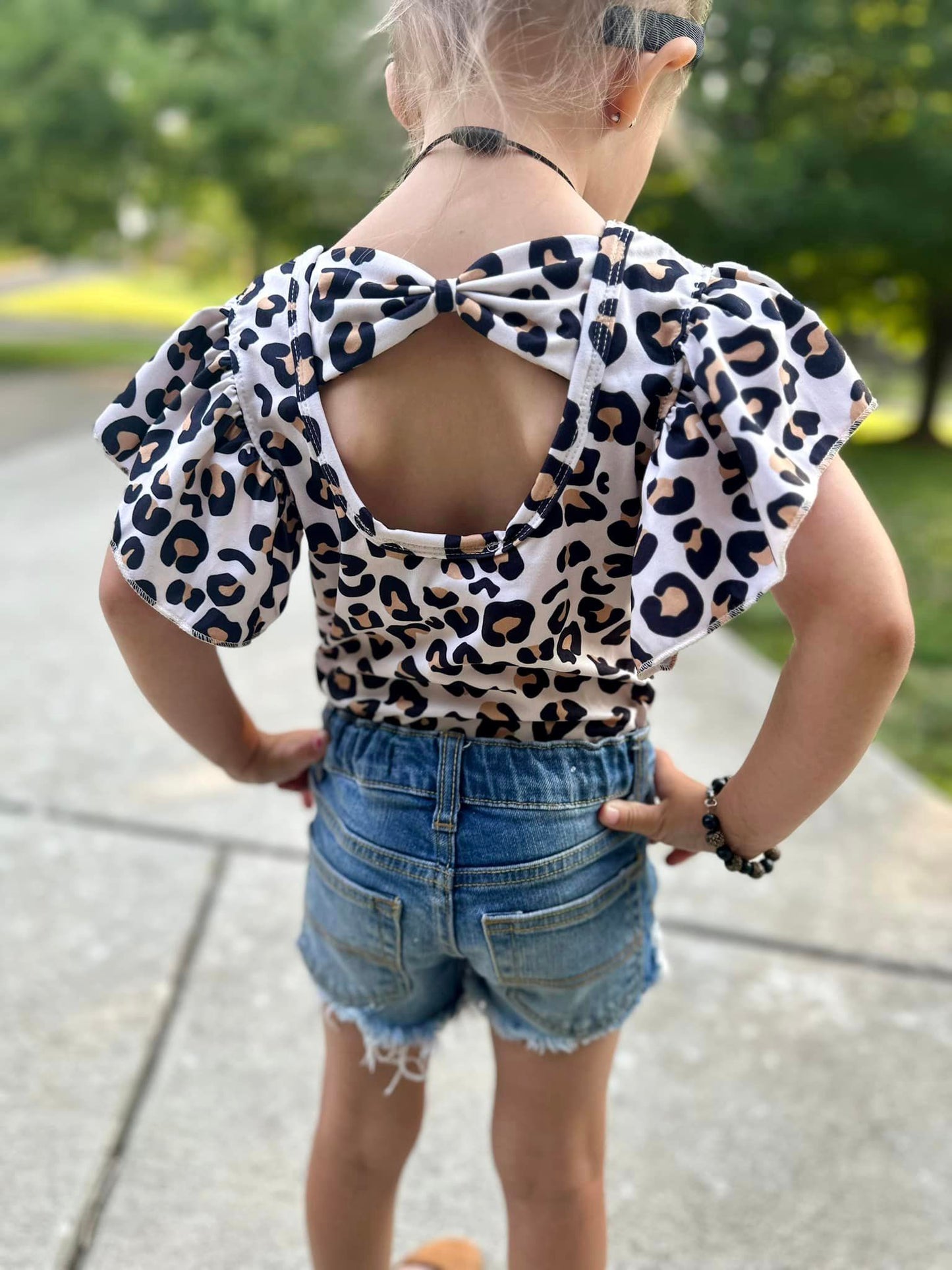 leopard bow back leo (all leo’s have buttons)