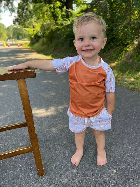 burnt orange raglan with plaid stripe sleeves