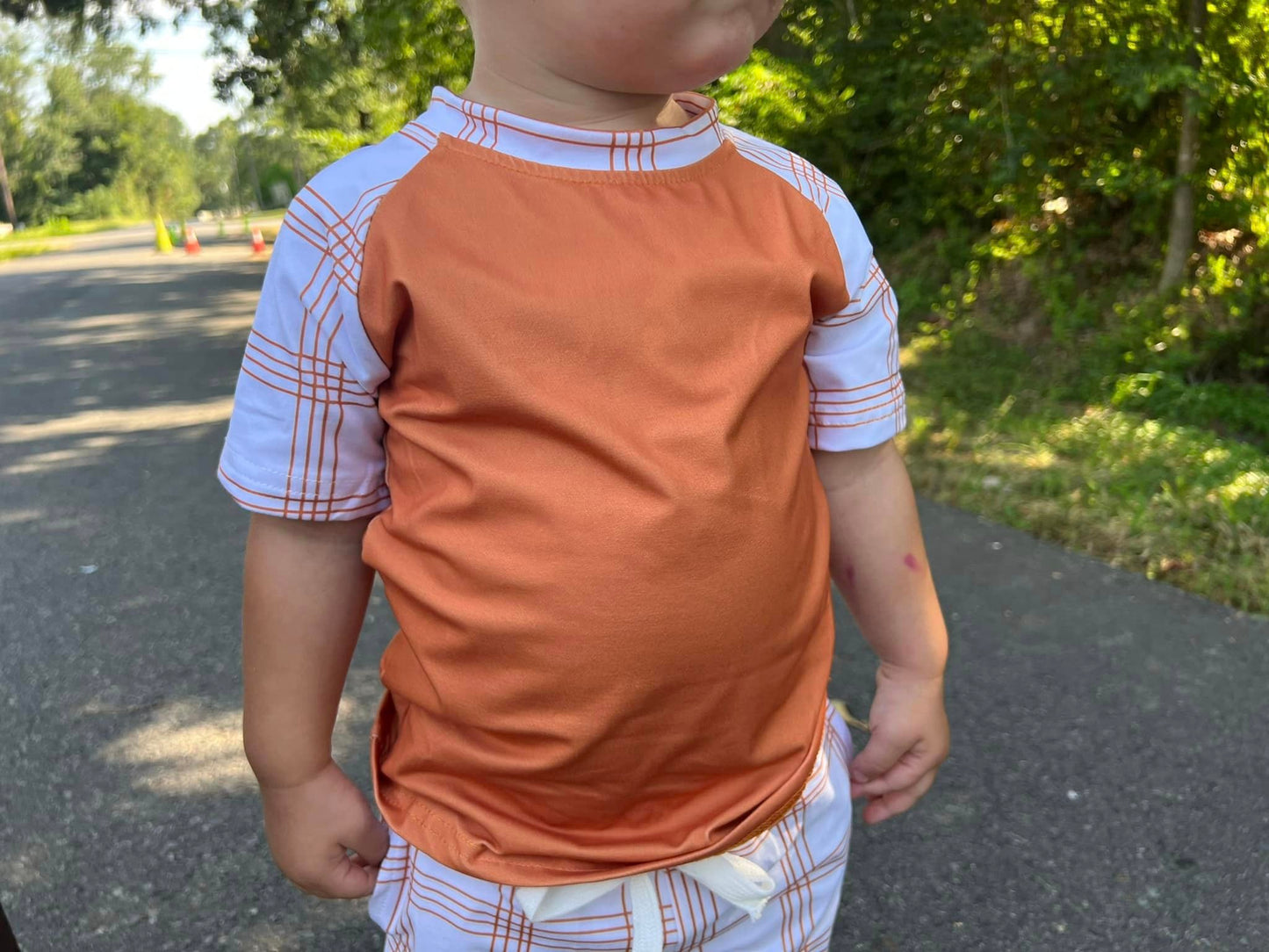 burnt orange raglan with plaid stripe sleeves