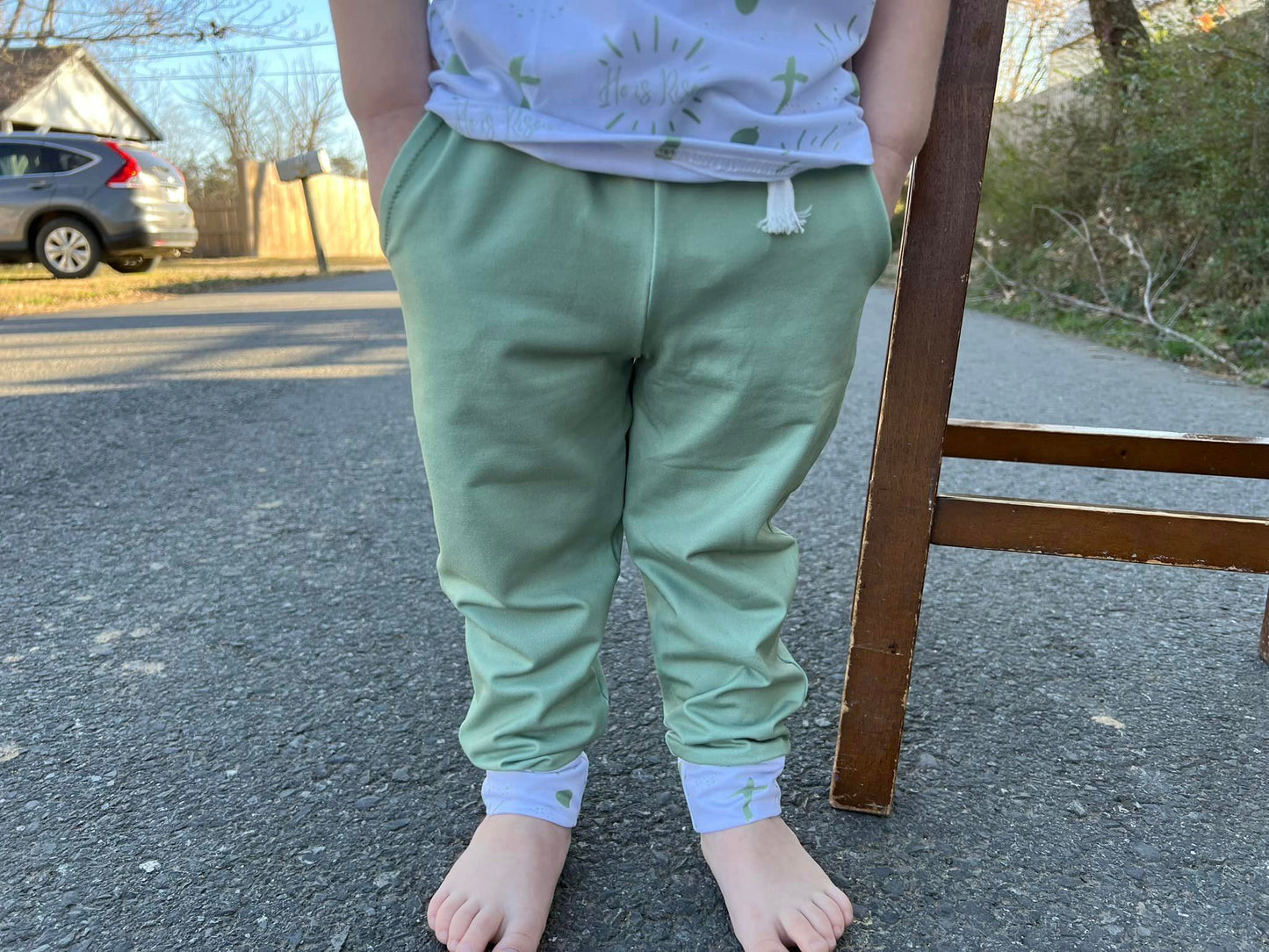 Olive joggers with he is risen cuffs