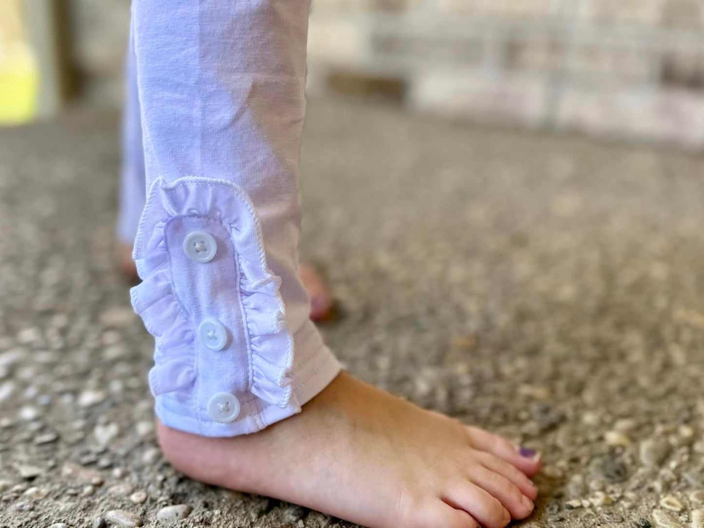 white ruffle button leggings